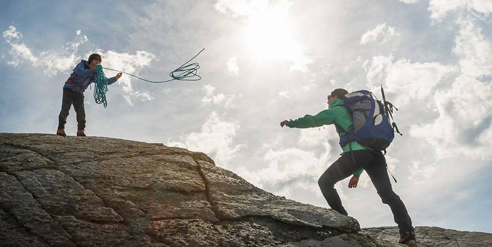 men-on-mountain-with-rope